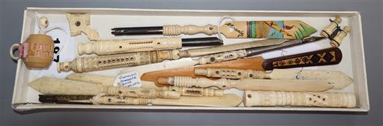A collection of ivory Stanhope dip pens/paper knives, an ivory tape measure and bodkin case, a Tunbridge Ware page turner, etc.